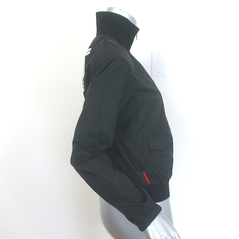 Authentic Prada Linea Rossa patch-embellished black nylon zip-up jacket, pre-owned, size 42