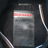 Prada Linea Rossa black nylon zip-up jacket with graphic patch embellishments, pre-owned luxury piece