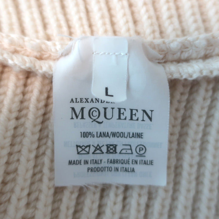 Alexander McQueen ribbed peplum cardigan in ivory wool, pre-owned with minor smudges and light snag, size L