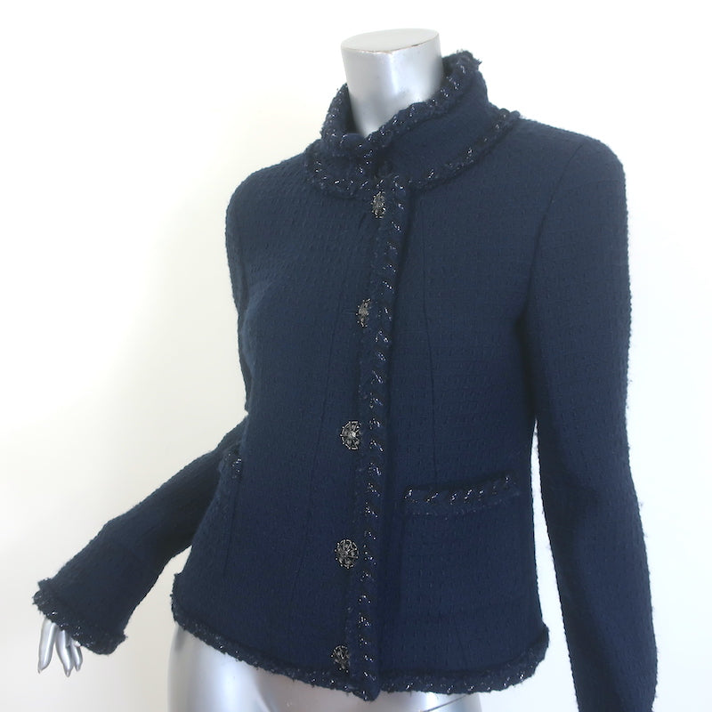 Authentic Chanel fringed tweed jacket in navy wool with metallic trim and CC star buttons, pre-owned, size 40.