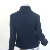 Authentic Chanel tweed jacket in navy wool with CC star buttons and metallic fringe trim, pre-owned, size 40