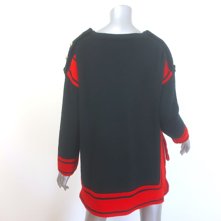 Alexander McQueen cashmere buttoned-shoulder sweater in black and red, pre-owned, gently worn authentic luxury piece.