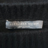 Authentic Alexander McQueen cashmere buttoned-shoulder sweater in black with red accents, pre-owned and gently worn.