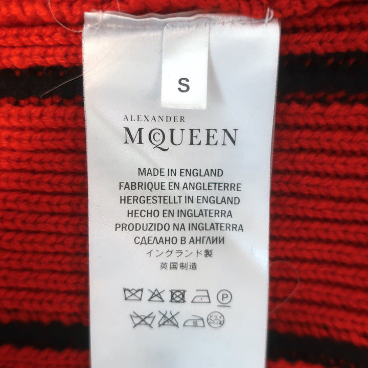 Alexander McQueen cashmere buttoned-shoulder sweater in black and red, authentic pre-owned, gently worn, size small.