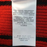 Alexander McQueen cashmere buttoned-shoulder sweater in black with red trim, size S, gently pre-owned luxury piece