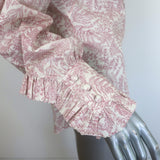 The Vampire's Wife Frill Seeker ruffled shirt in white with red botanical print, pre-owned luxury designer blouse