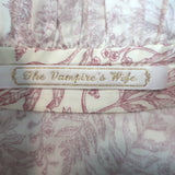 The Vampire's Wife Frill Seeker ruffled shirt, white with red botanical print — authentic pre-owned designer blouse