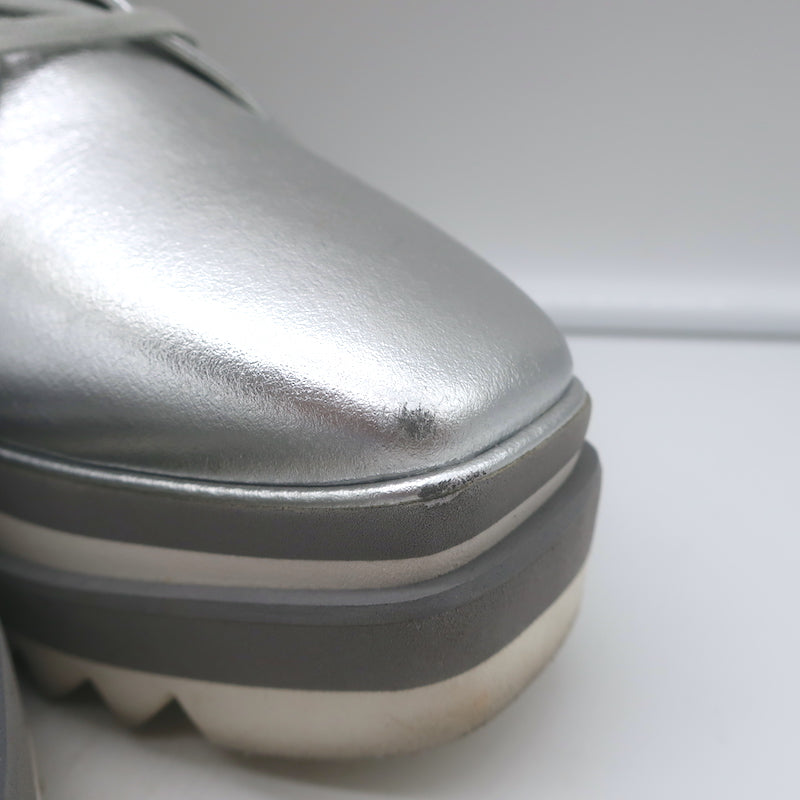 Stella McCartney Elyse platform sneakers, silver faux leather — authentic pre-owned, size EU 39