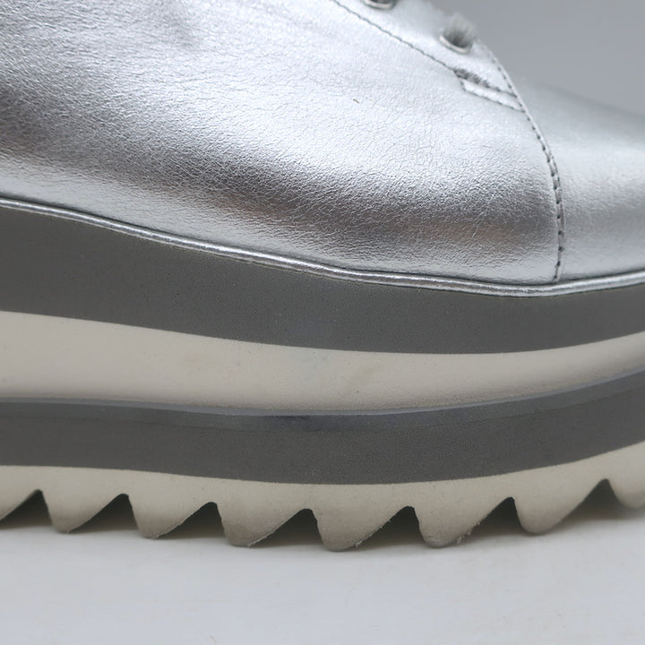 Stella McCartney Sneak Elyse platform sneakers in silver faux leather - authentic pre-owned, light wear