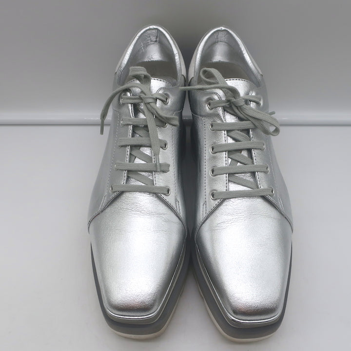 Stella McCartney Elyse platform sneakers in silver faux leather, authentic pre-owned designer pair