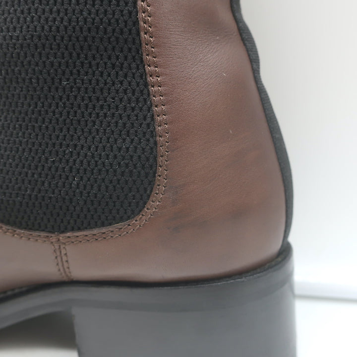 Chanel cap-toe CC Chelsea boots in dark brown leather, pre-owned authentic luxury with refined wear