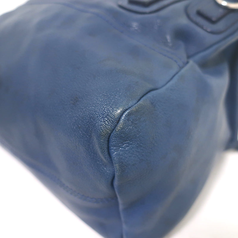 Here are three optimized alt tag options (each under 125 characters): 1. Givenchy Medium Pandora navy leather crossbody with silver hardware, pre-owned, authentic luxury with gentle wear 2. Givenchy Pandora medium navy leather crossbody, silver-tone hardware, pre-owned and guaranteed authentic, luxe patina 3. Givenchy Medium Pandora navy leather crossbody, pre-owned authentic designer bag with silver hardware