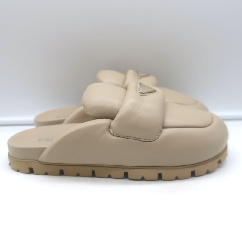 Prada triangle-logo padded flat mules in nude leather, pre-owned, excellent condition