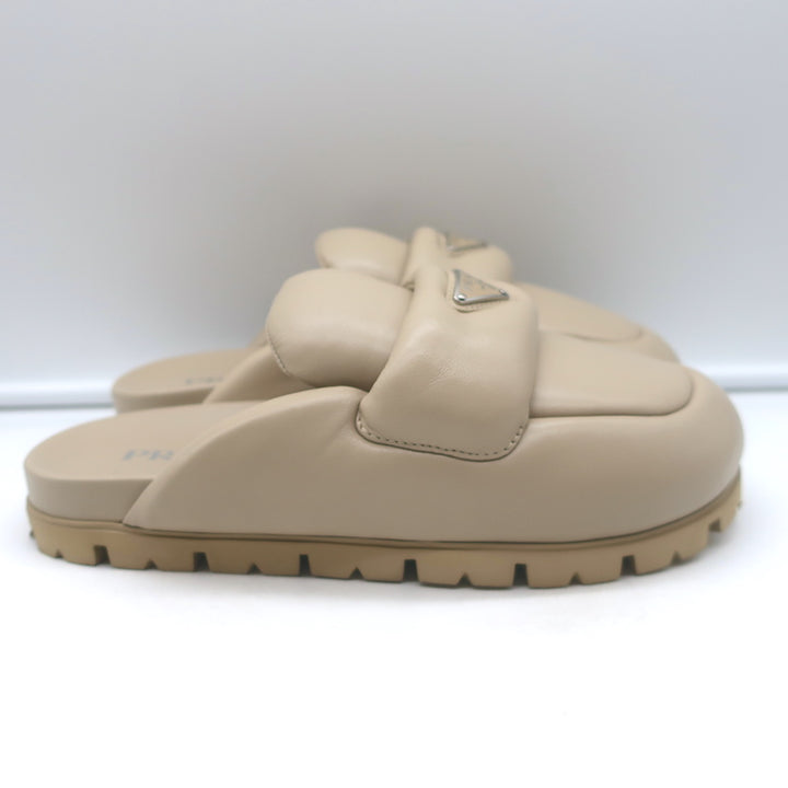 Prada triangle-logo padded flat mules in nude leather, pre-owned, excellent condition