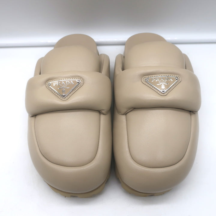 Prada triangle-logo padded flat mules in nude leather, size 38.5 - authentic pre-owned luxury