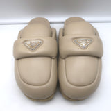 Prada triangle-logo padded flat mules in nude leather, size 38.5 - authentic pre-owned luxury