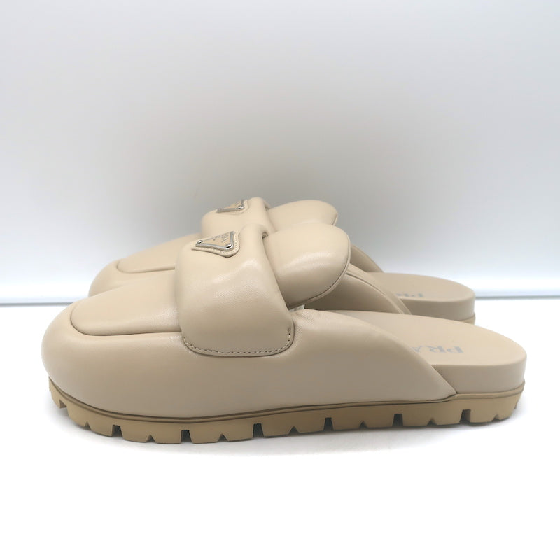 Prada triangle-logo padded flat mules in nude leather, authentic pre-owned (new without tags)