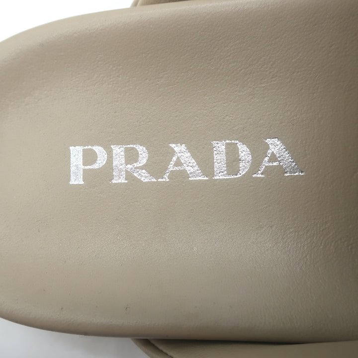 Prada triangle-logo padded flat mules, nude leather, pre-owned (new without tags), authentic luxury women&