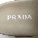 Prada triangle-logo padded flat mules, nude leather, pre-owned (new without tags), authentic luxury women's flats