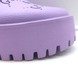 Gucci Elea perforated GG platform mules in lavender rubber, size 38 — authentic pre-owned, gently worn.