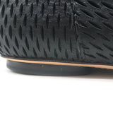 Authentic Chanel black perforated leather cap-toe flat ankle boots, size 38, pre-owned and gently worn.