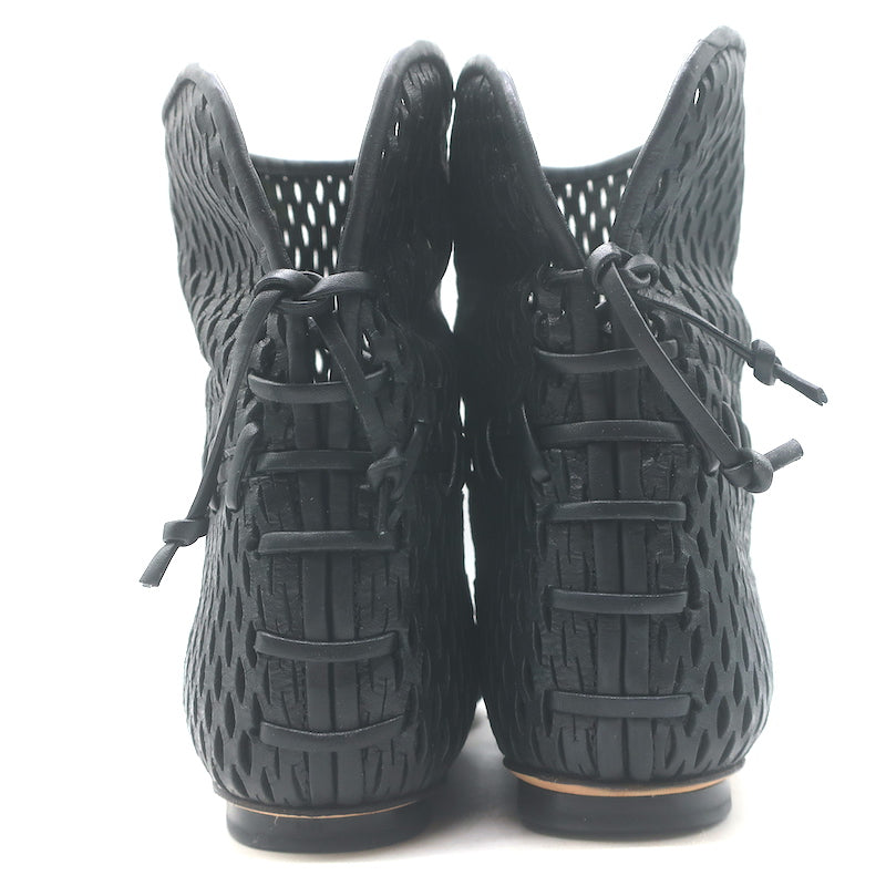 Authentic Chanel cap-toe perforated leather flat ankle boots in black, gently pre-owned (EU 38 / US 7.5)