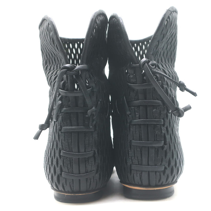 Authentic Chanel cap-toe perforated leather flat ankle boots in black, gently pre-owned (EU 38 / US 7.5)