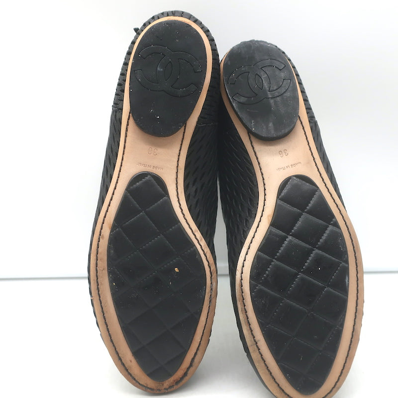 Chanel perforated black leather cap-toe flat ankle boots, size 38, pre-owned authentic luxury with gentle wear.
