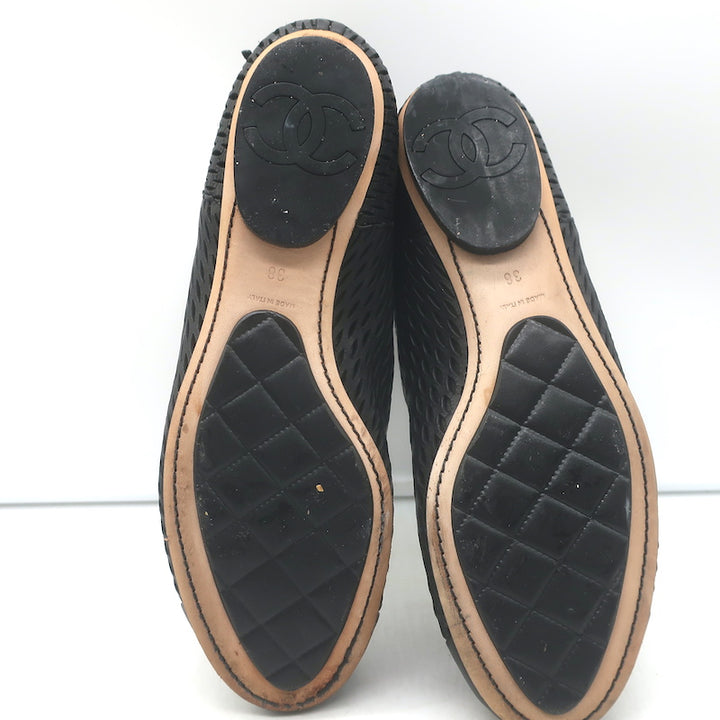 Chanel perforated black leather cap-toe flat ankle boots, size 38, pre-owned authentic luxury with gentle wear.