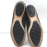 Chanel perforated black leather cap-toe flat ankle boots, size 38, pre-owned authentic luxury with gentle wear.