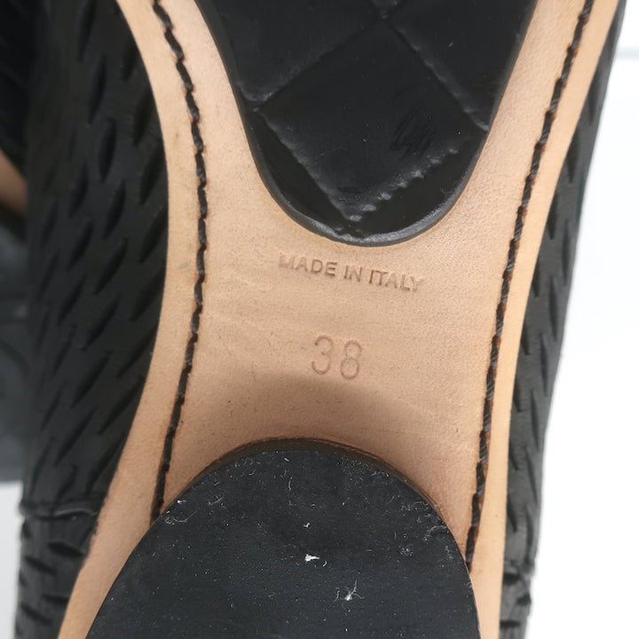Chanel cap-toe perforated black leather flat ankle boots, authentic pre-owned size 38