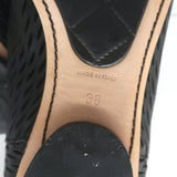 Chanel cap-toe perforated black leather flat ankle boots, authentic pre-owned size 38