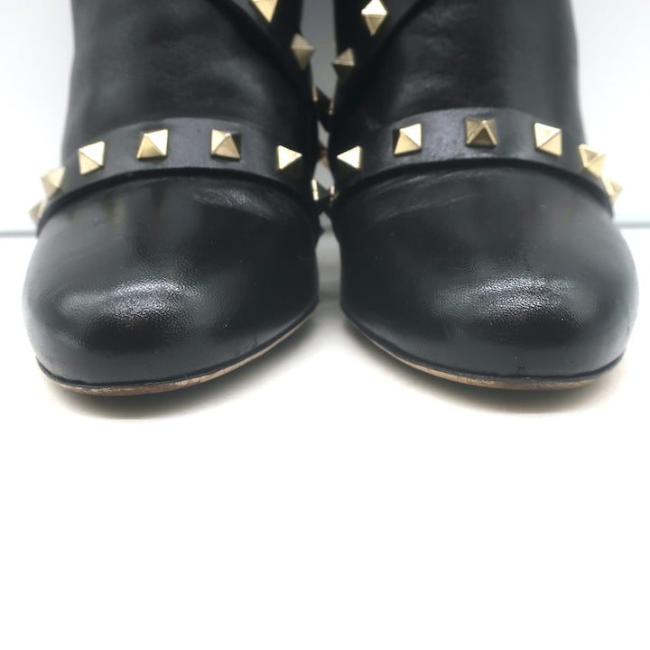 Valentino Rockstud bow ankle boots in black leather, pre-owned luxury designer boots with authentic stud detailing