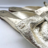 Valentino Unchateau bow mules in gold metallic cracked leather, pre-owned, luxury flat slip-on with signature bow (EU 38.5)