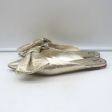 Authentic Valentino Unchateau flat bow mules in gold metallic cracked leather, pre-owned in good condition