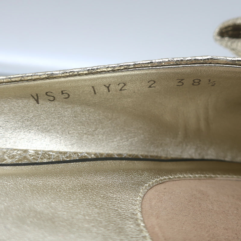 Valentino Unchateau bow mules in gold metallic cracked leather, pre-owned, authentic luxury flat with signature bow