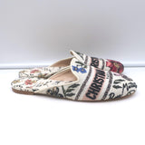 Authentic Christian Dior canvas floral-embroidered flat mules in white/multi, pre-owned and gently worn luxury flats