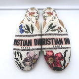 Christian Dior floral-embroidered canvas flat mules in white with multicolor embroidery, pre-owned