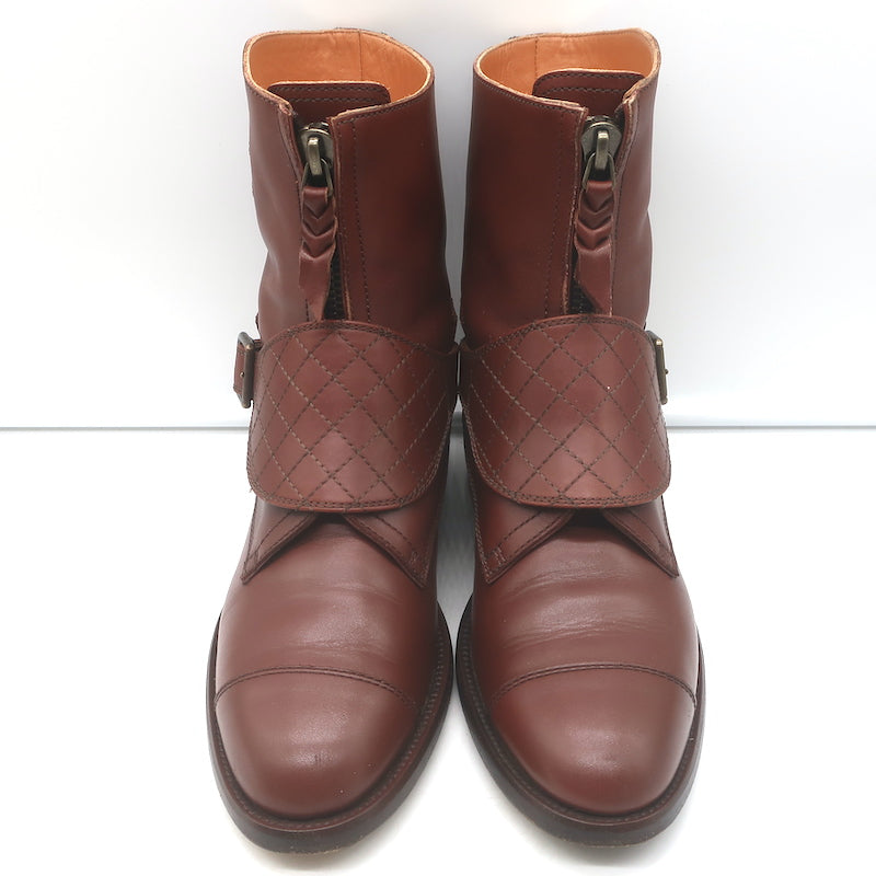 Authentic Chanel CC-embroidered cap-toe quilted ankle boots in brown leather, pre-owned gently worn.