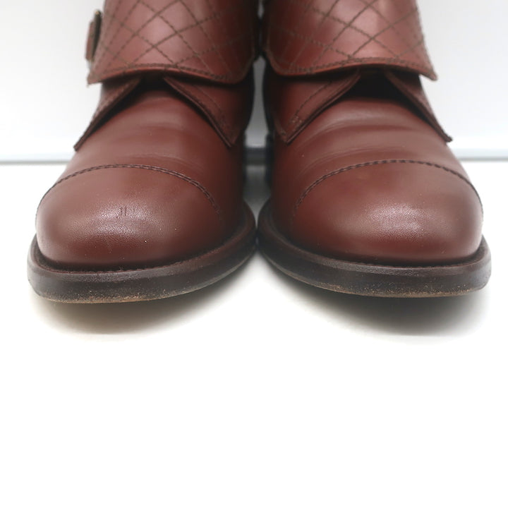 Chanel cap-toe quilted ankle boots in brown leather with CC embroidery, authentic pre-owned, gently worn.