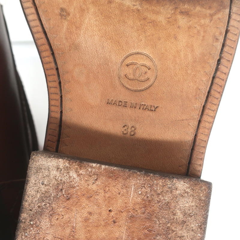 Chanel quilted cap-toe ankle boots in brown leather with CC embroidery - authentic pre-owned, gently worn