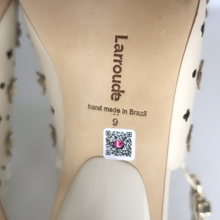 Larroude slingback pumps in ivory perforated leather with jasmine flower embellishment, pre-owned, size 9, good condition.