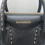 Authentic Givenchy Small Antigona chain-trimmed black leather crossbody bag, pre-owned with luxe gold hardware.