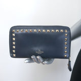 Valentino Rockstud zip-around wallet in dark navy leather with gold hardware, pre-owned authentic luxury