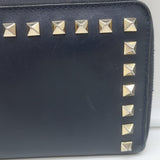 Valentino Rockstud zip-around wallet in dark navy leather with gold hardware, pre-owned