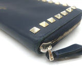 Valentino Rockstud zip-around wallet in dark navy leather, gold hardware, pre-owned with gentle wear — authentic luxury