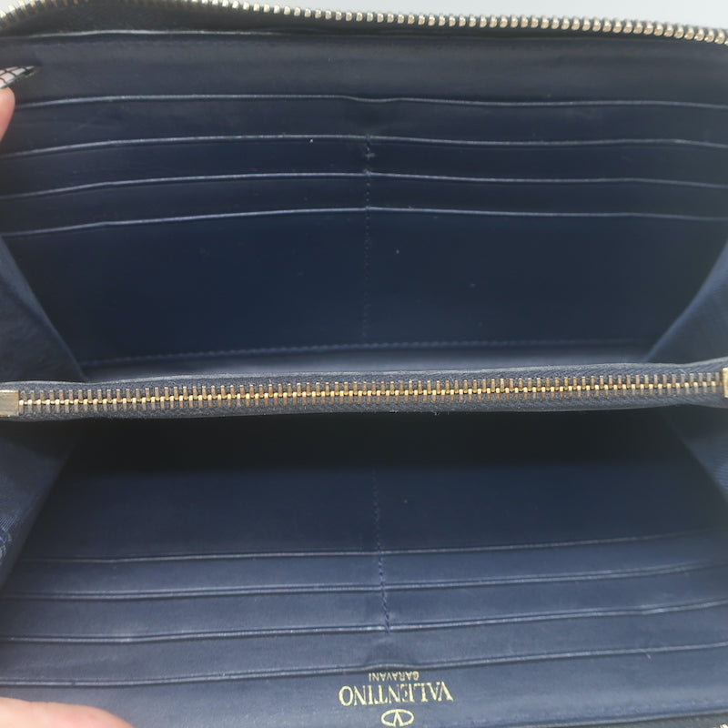 Valentino Rockstud zip-around wallet in dark navy leather with gold studs, pre-owned luxury accessory