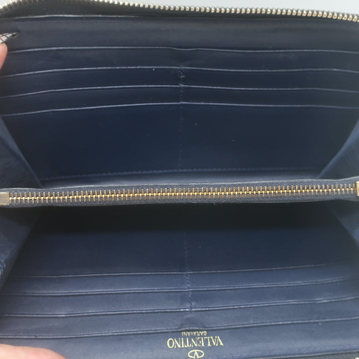Valentino Rockstud zip-around wallet in dark navy leather with gold studs, pre-owned luxury accessory
