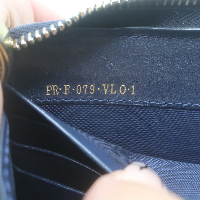 Authentic Valentino Rockstud zip-around wallet in dark navy leather with gold hardware, pre-owned