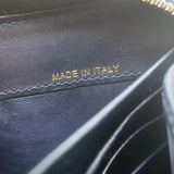 Authentic Valentino Rockstud zip-around wallet in dark navy leather with gold hardware, pre-owned